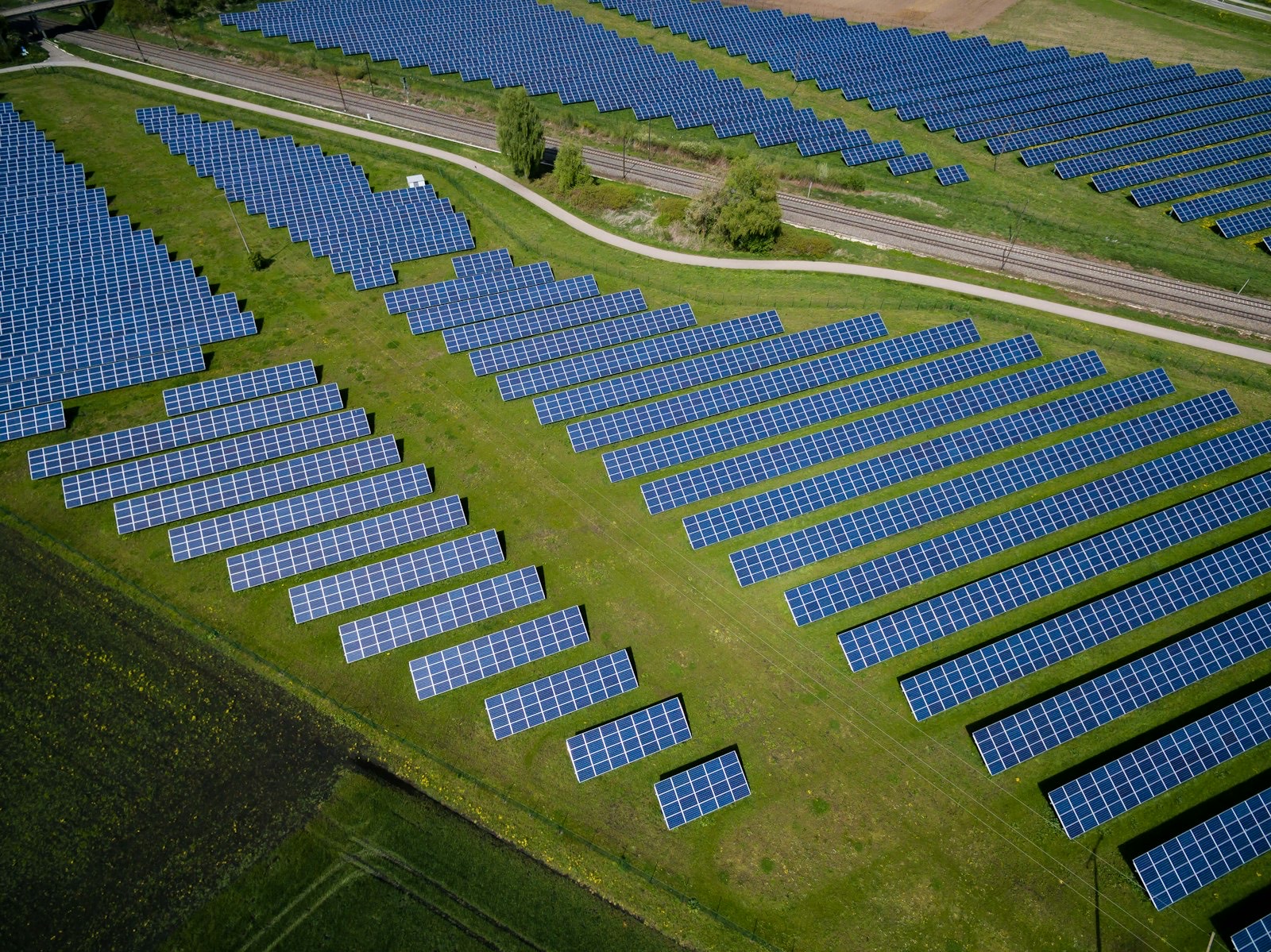 Aerial view of a solar farm on green fields